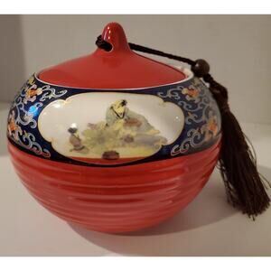 Red And Blue Decorative Urn With Suctioned On Lid With Tassle